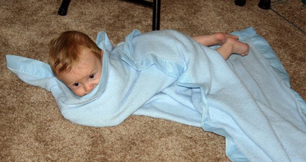 <p>Christian rolled up in a blanket</p>