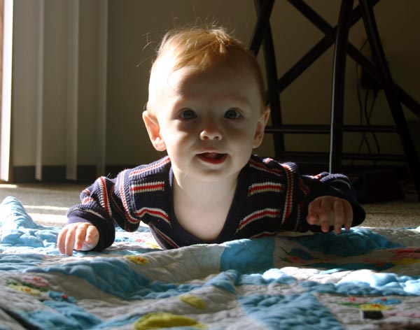 <p>Christian on a blanket in the sunshine</p>