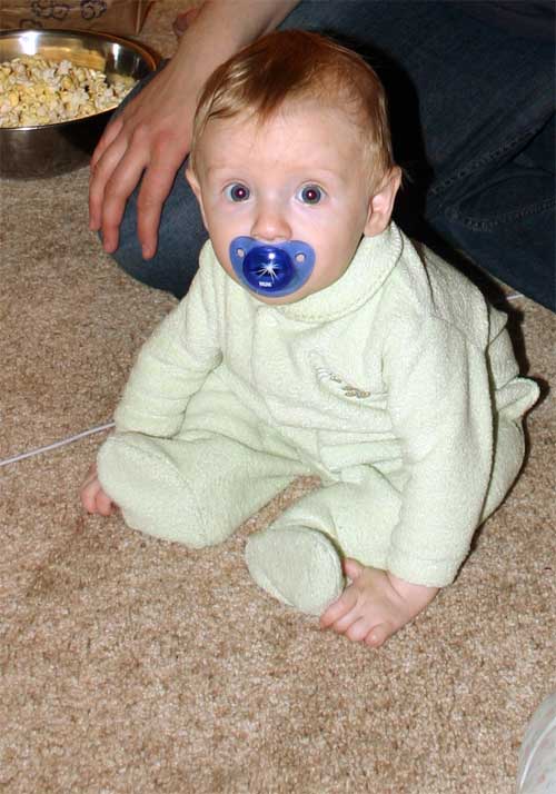 <p>Christian sitting on the floor</p>