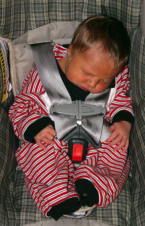 Christian buckled into his carseat